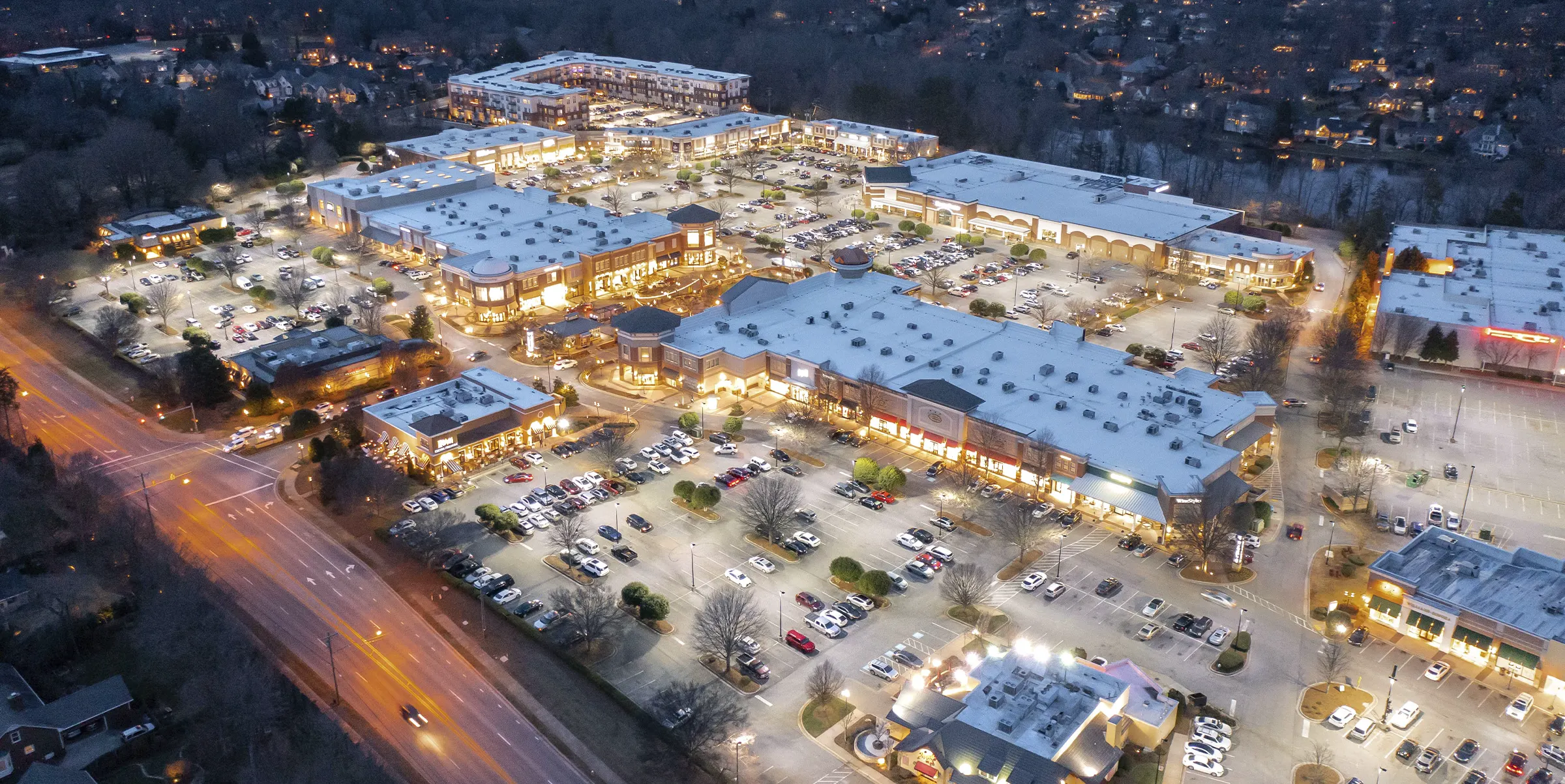 Aerial view of Friendly Center lit up at night